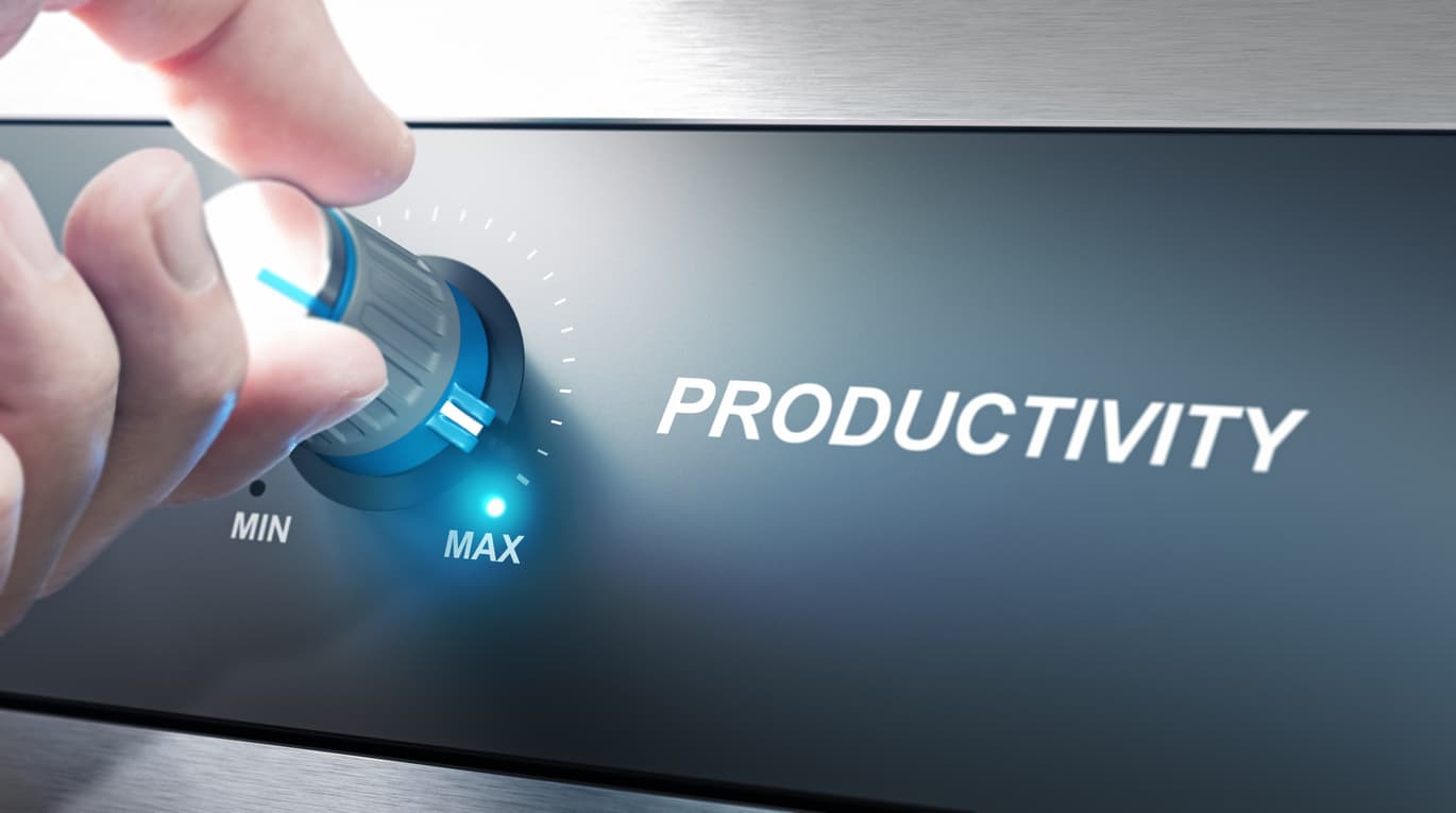A hand boosting productivity by turning a dial labeled “productivity” toward the “Max” setting