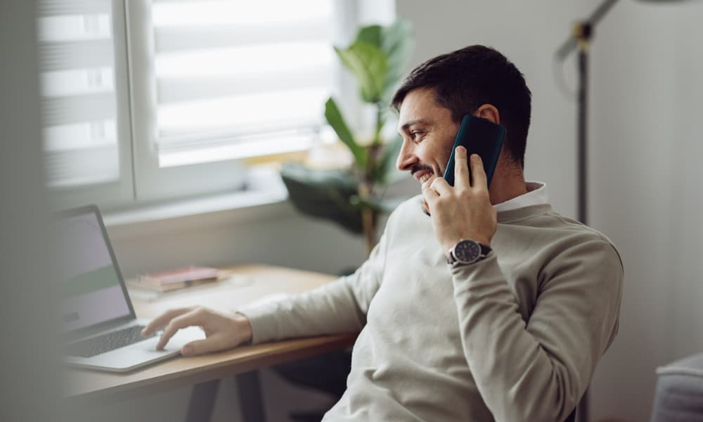 A salesman talking on the phone.