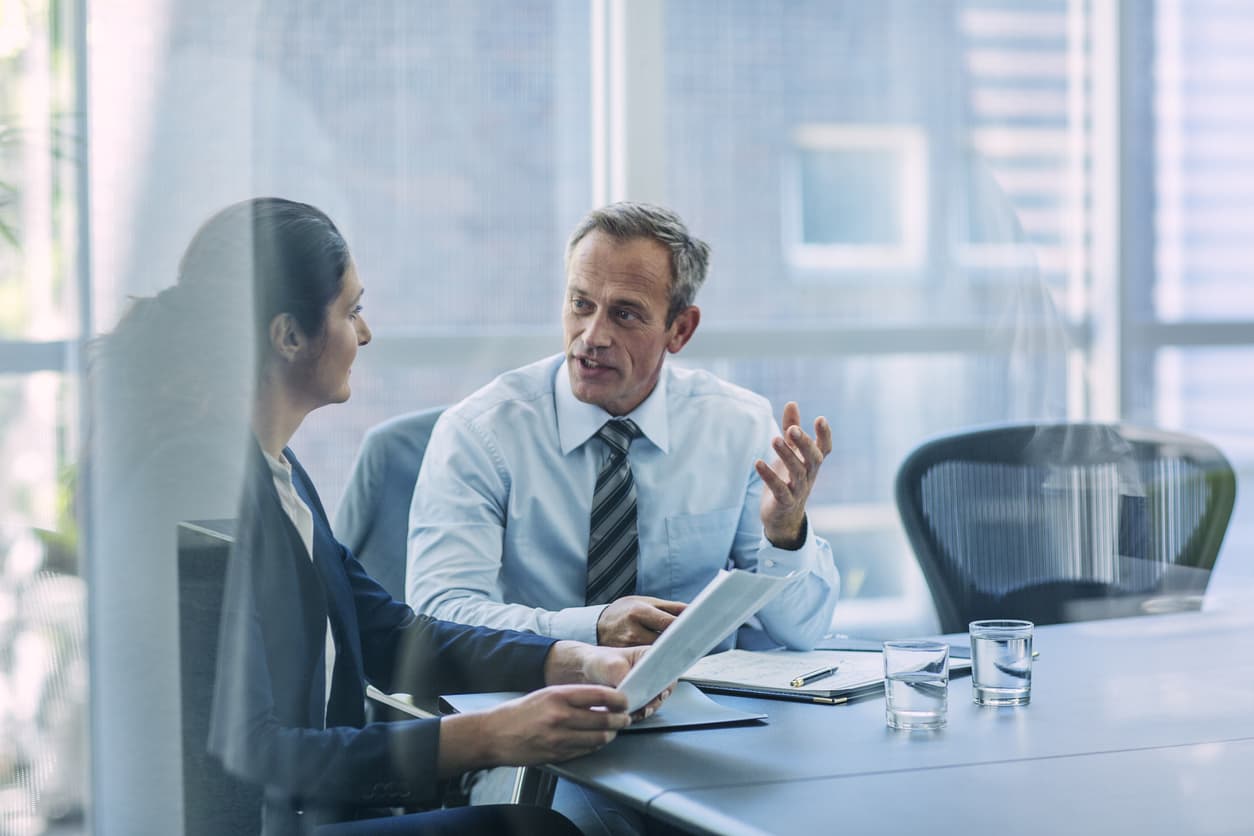 An employer explaining something to the employee