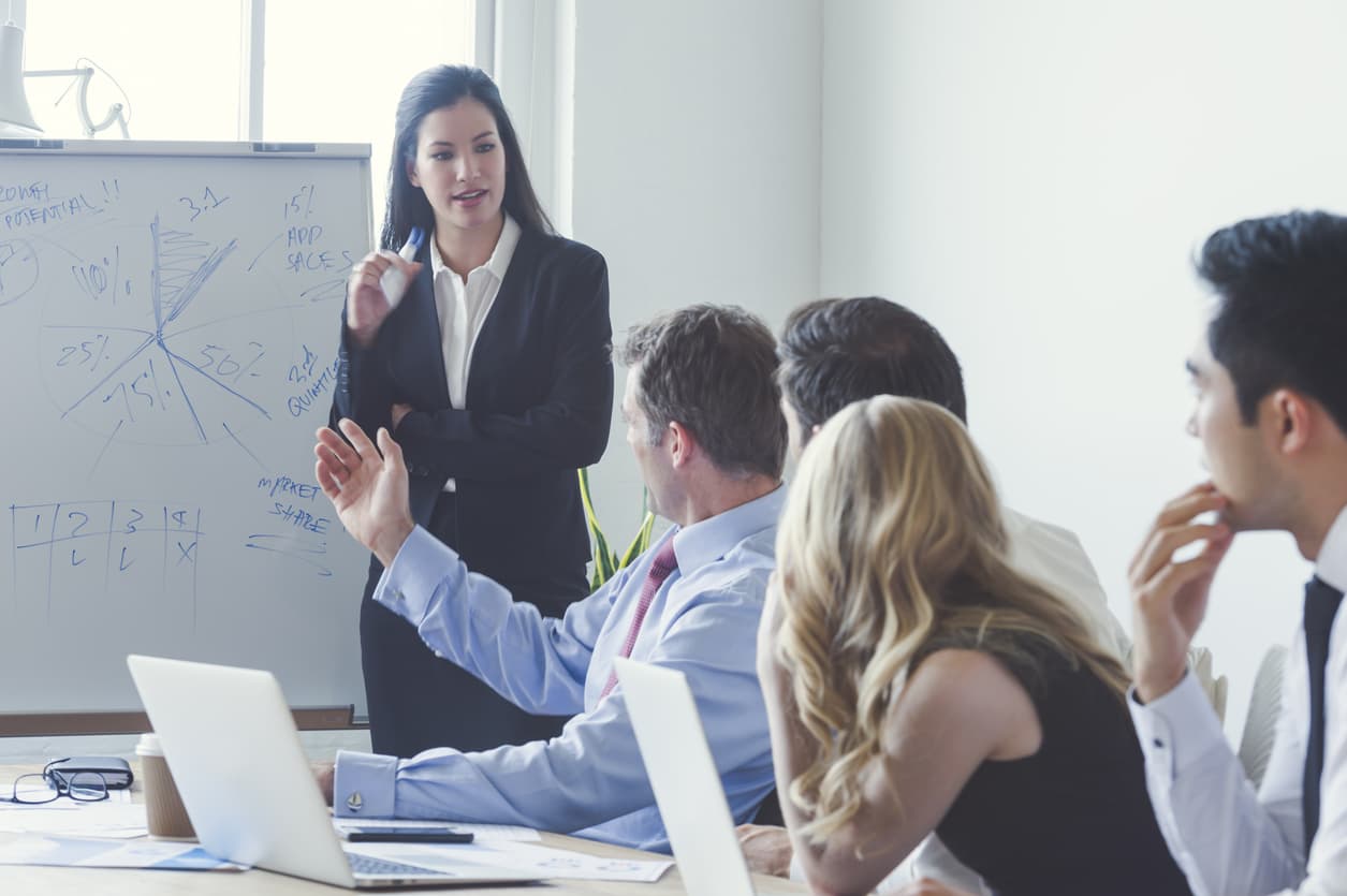 A group of businesspeople sit in a training