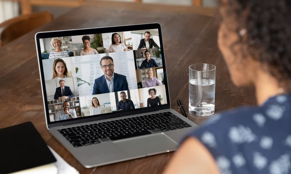 A woman on a video conference call with her sales team